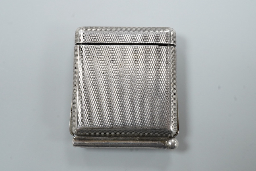 An early to mid 20th century engine turned 935 standard white metal combination travelling watch/pencil holder and notepad section, with Arabic dial, 42mm.